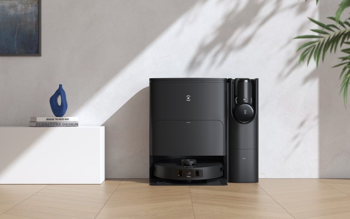 A black robot vacuum on its docking station