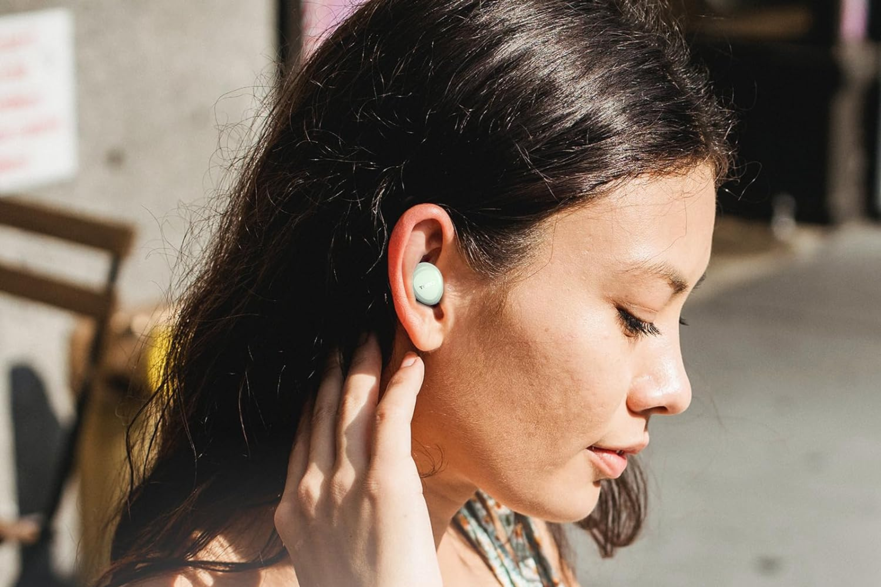 TOZO A1 Mini Wireless Earbuds in persons ear 