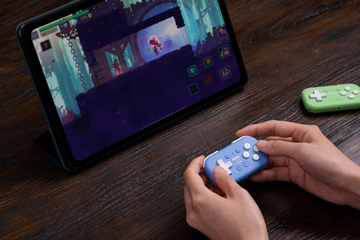 Tiny purple game controller playing a game on a tablet