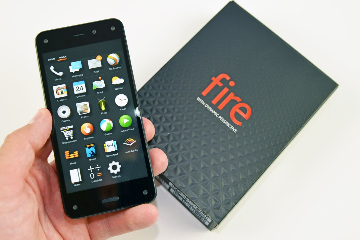 The Amazon Fire Phone being held in front of its box