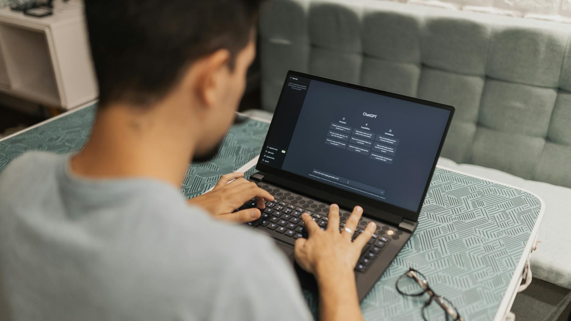 A person using ChatGPT on a laptop