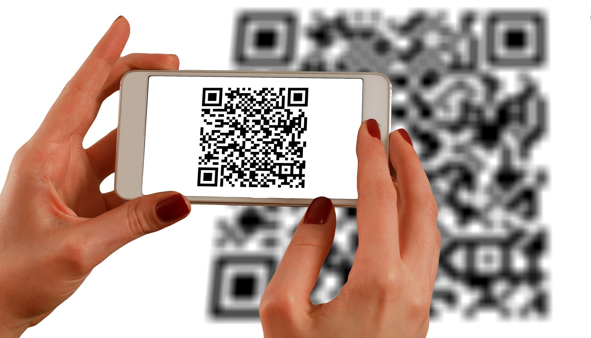 person scanning a QR code on a phone