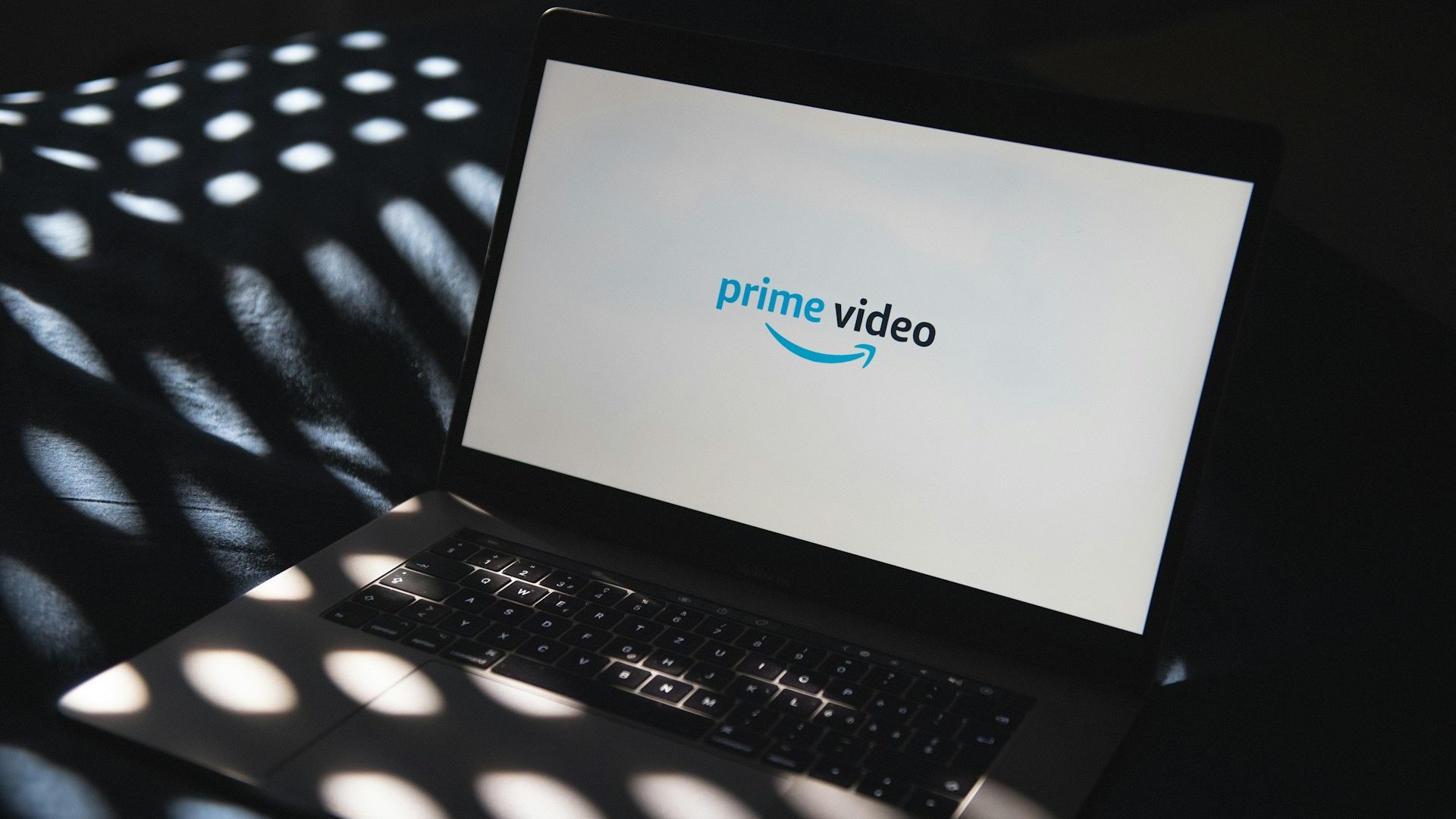 The Prime Video logo on a laptop