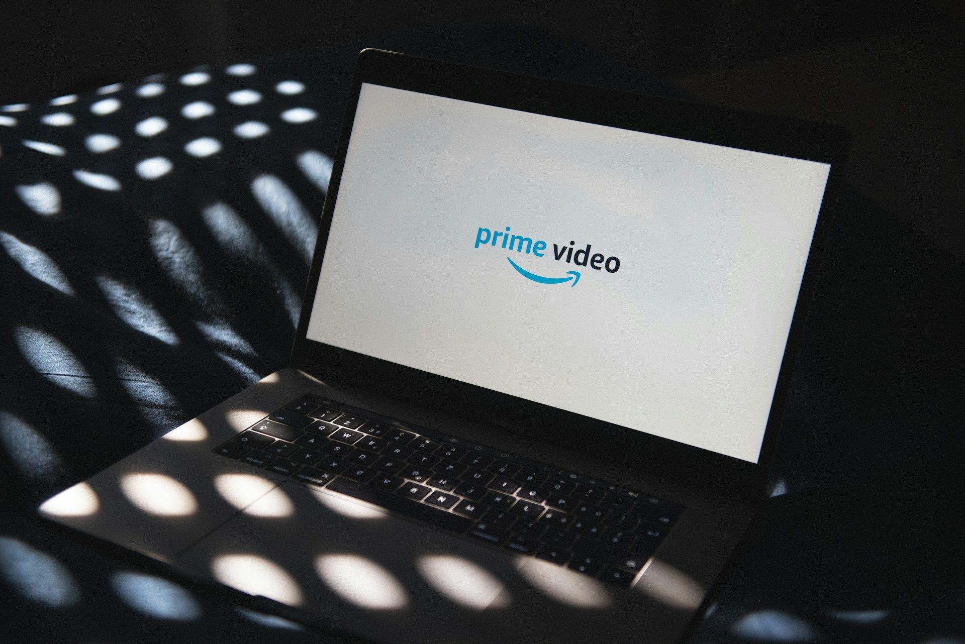 The Prime Video logo on a laptop
