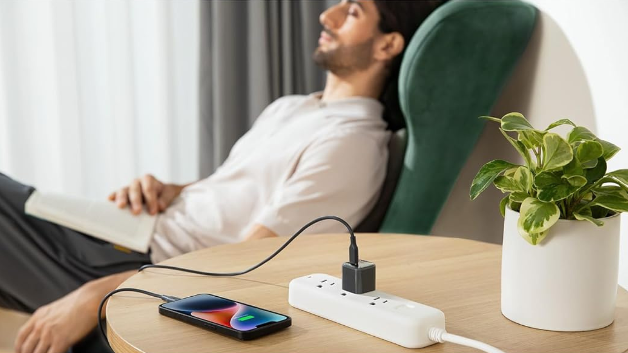 Person sleeping next to Anker 511 charger with phone plugged in