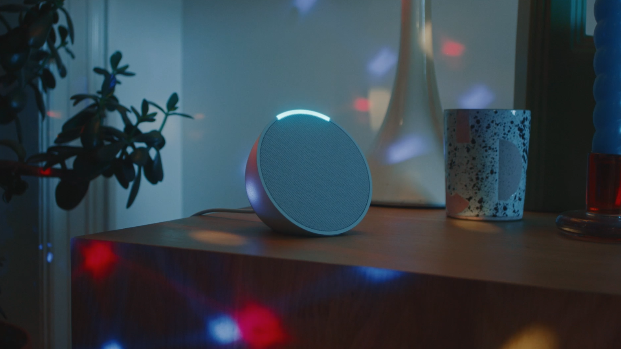 Amazon Echo Pop speaker in a disco on table