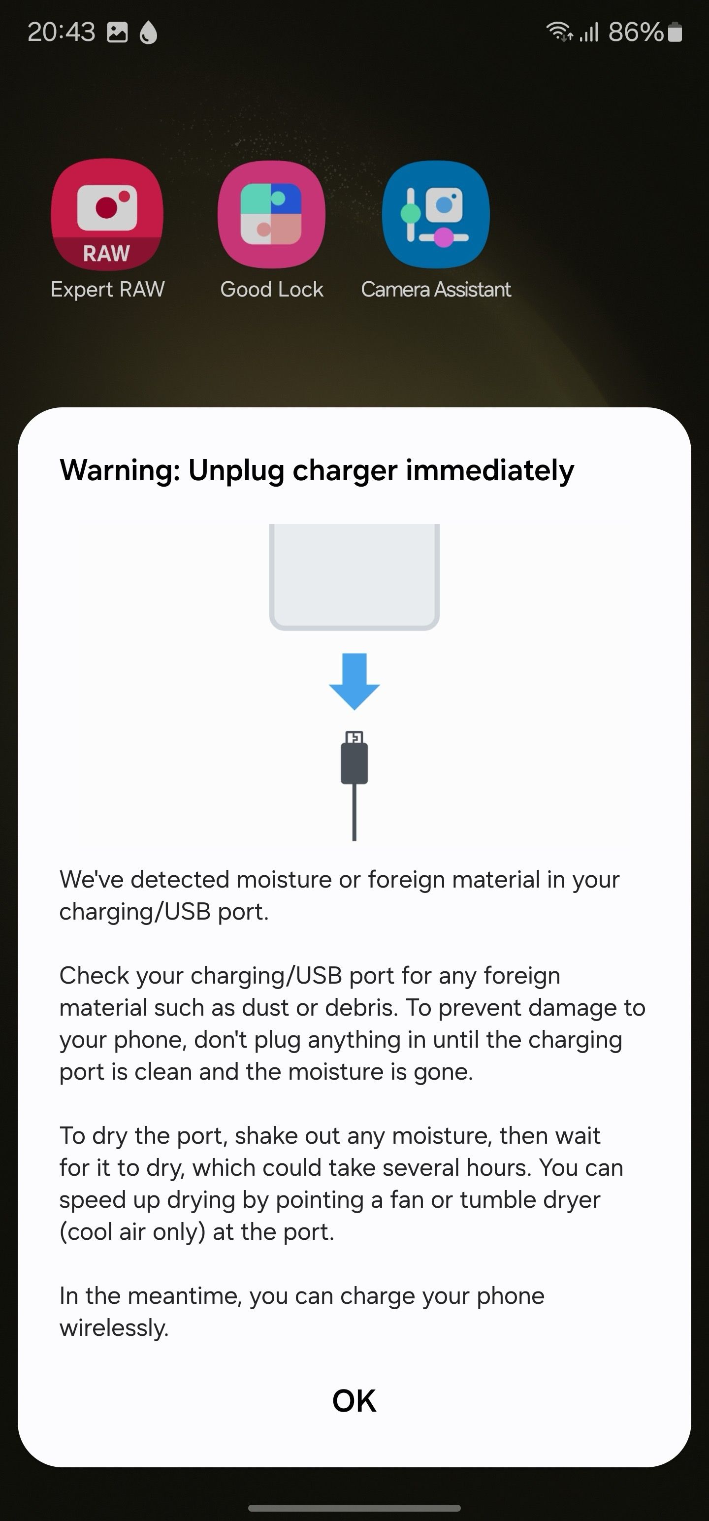 A warning pop-up to unplug phone immediately