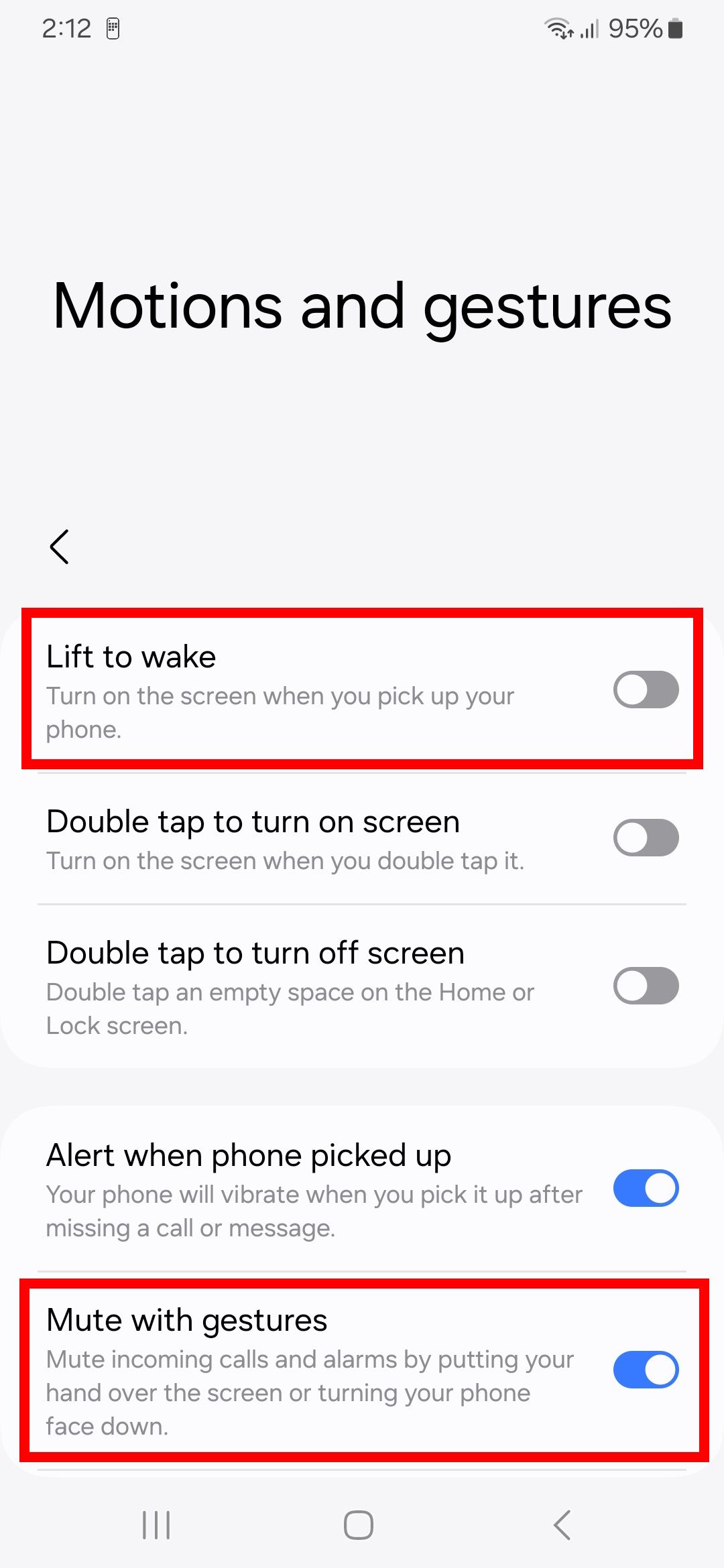 Two red rectangle outline highlighting lift to wake and mute with gestures toggles in motion and gestures options