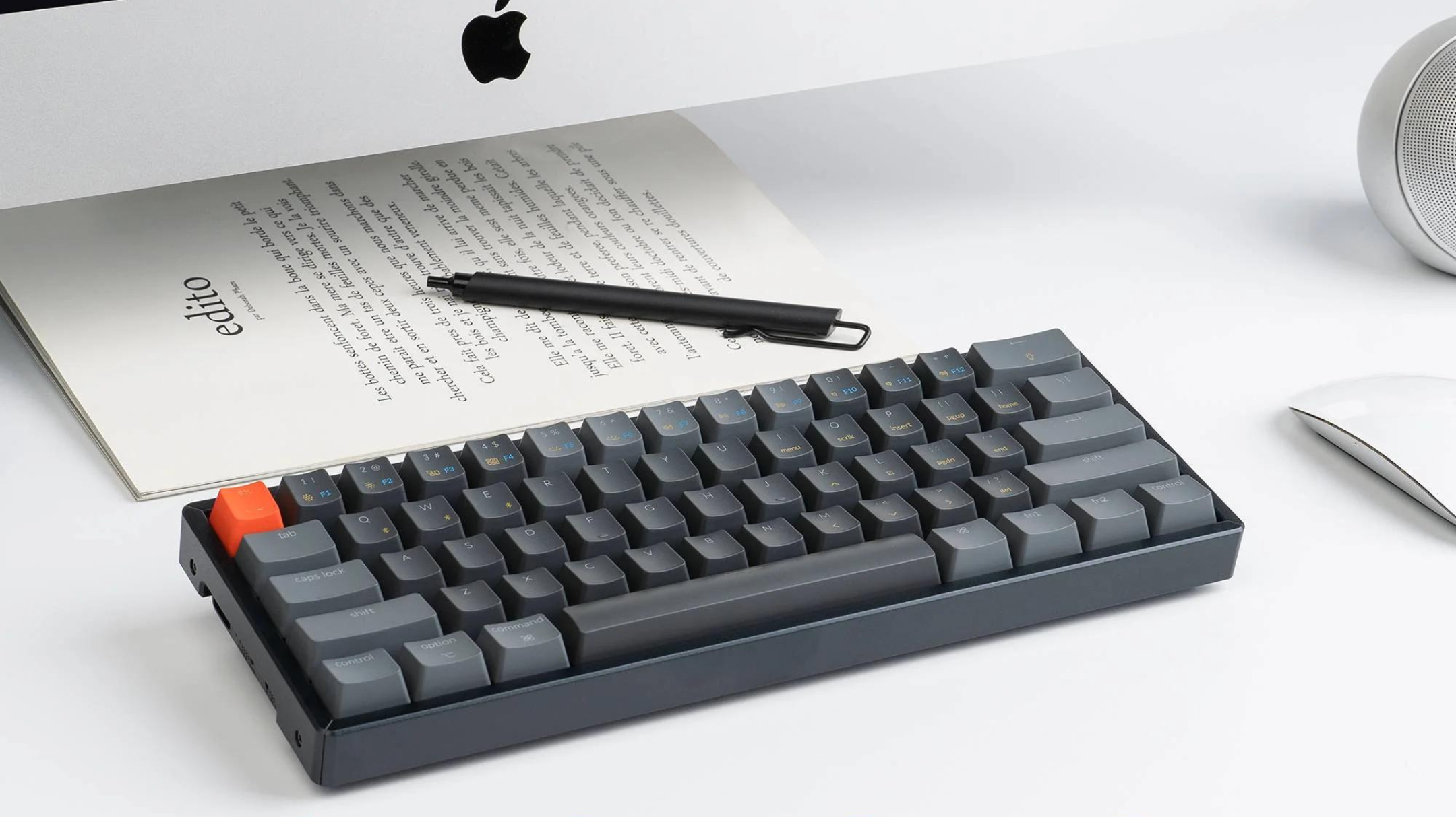 Keychron K12 60% Layout Bluetooth Wireless/USB Wired Mechanical Keyboard on desk in front of mac computer