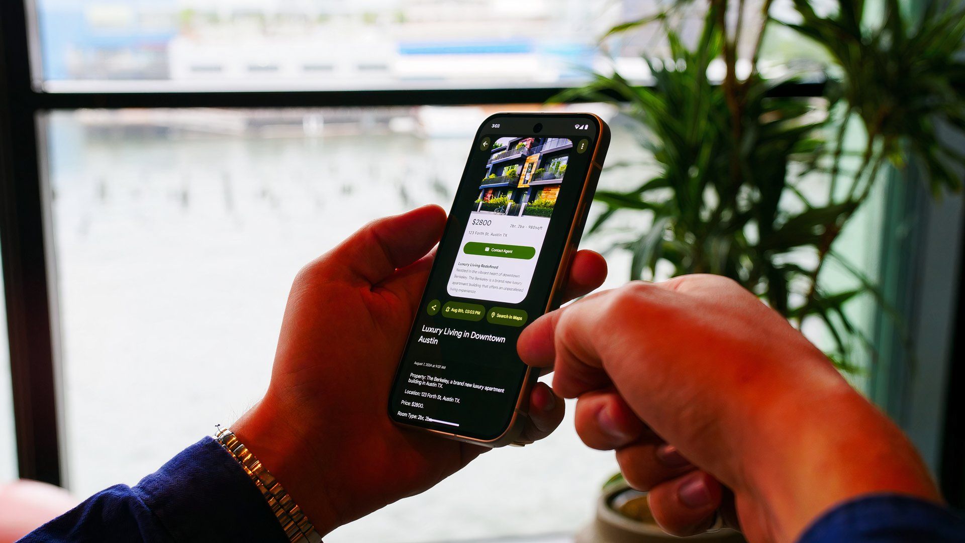 A pair of hands holding a Google Pixel 9 with illuminated screen