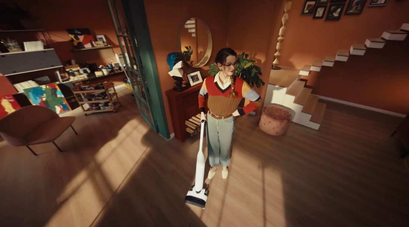 A young woman cleaning her home with the Roborock Flexi Lite