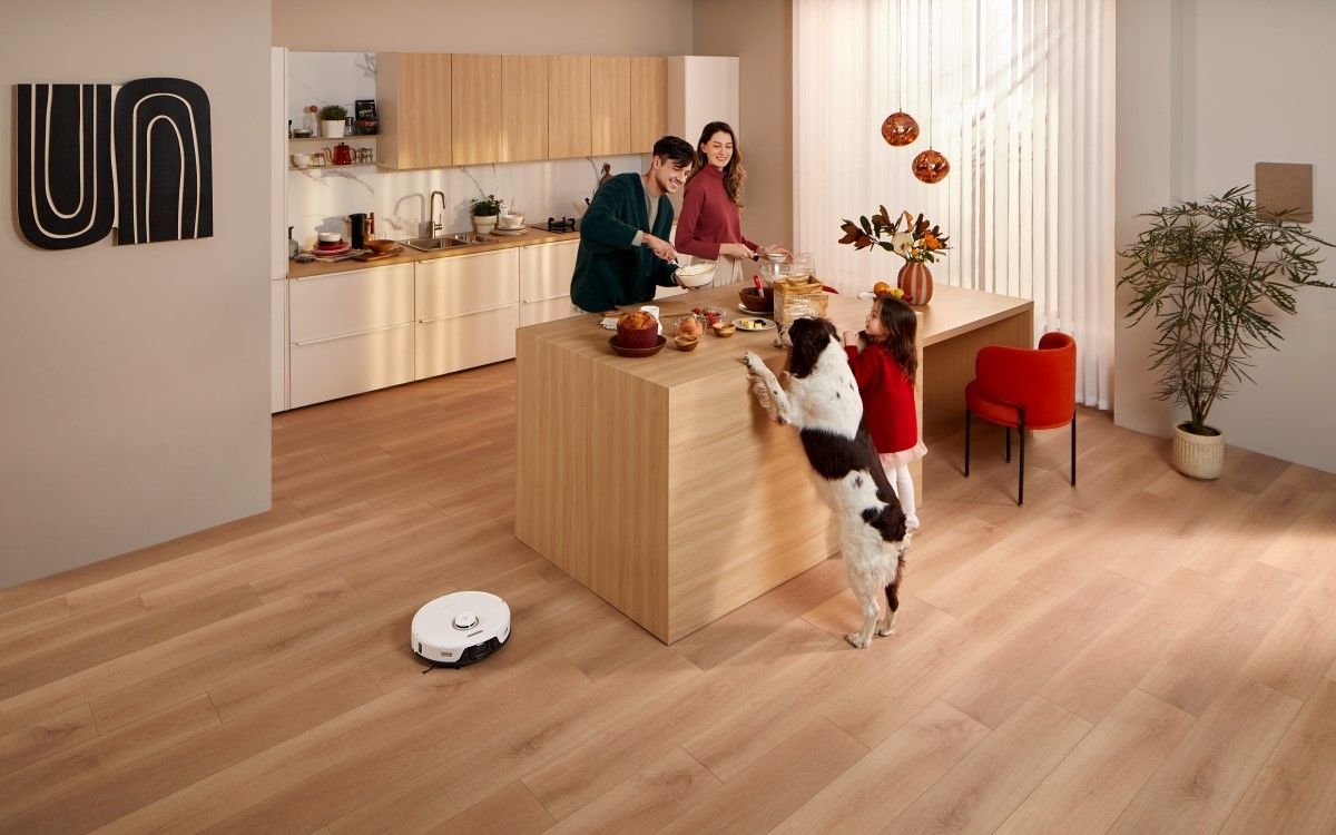 A family in their kitchen with S8 Pro Ultra cleaning the floor