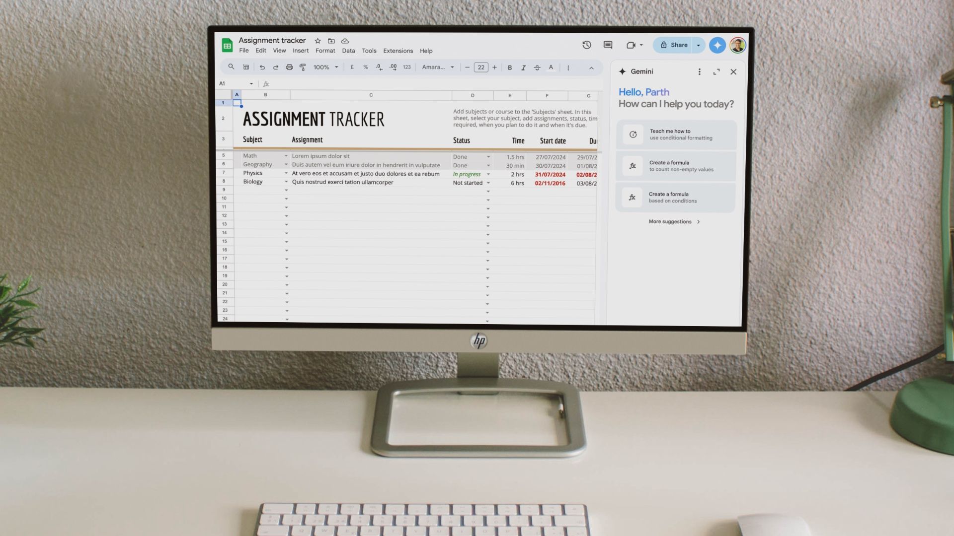 A computer monitor with Google Sheets sits on a white desk.