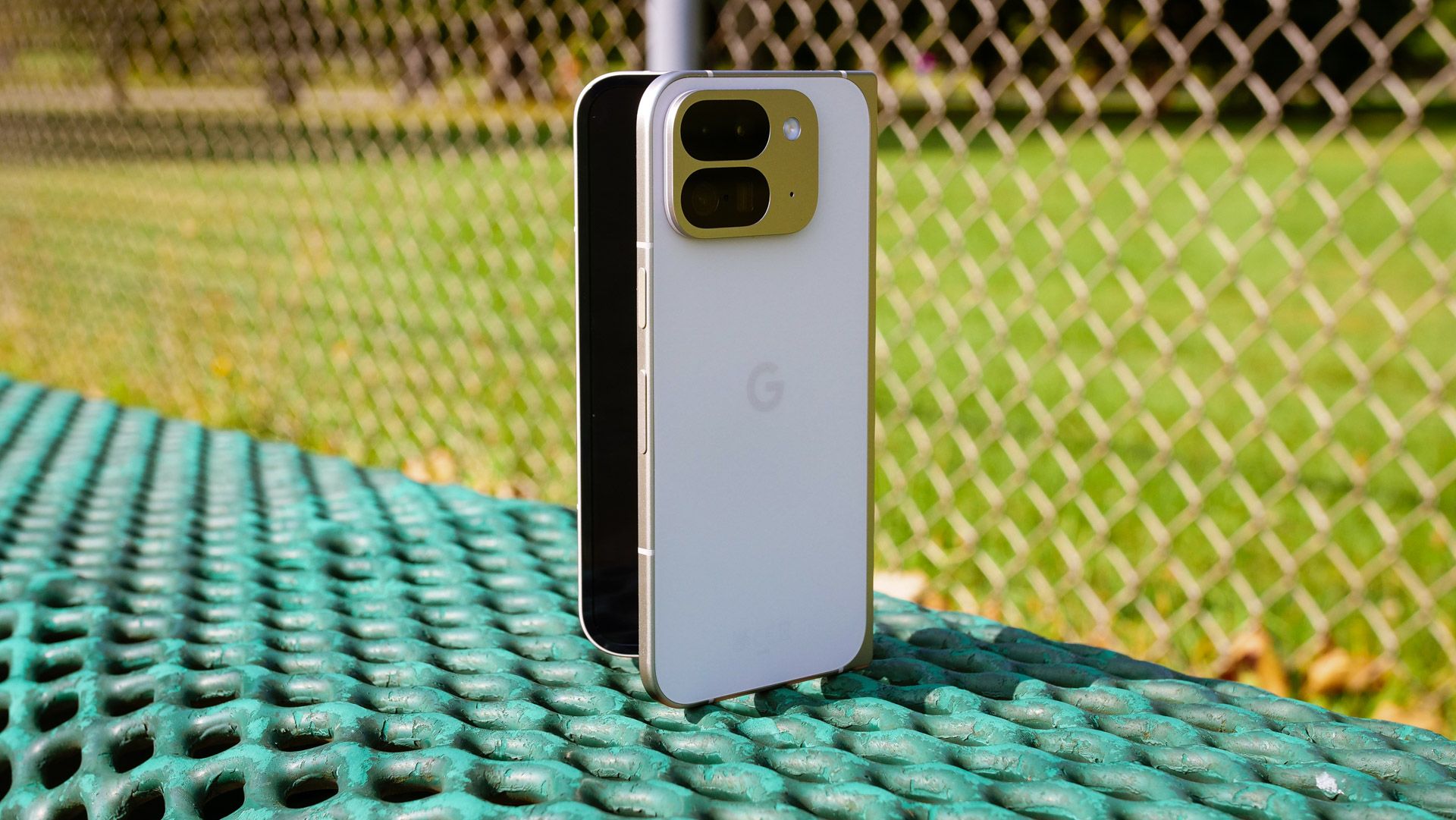 Google Pixel 9 Pro Fold resting on a park bench.