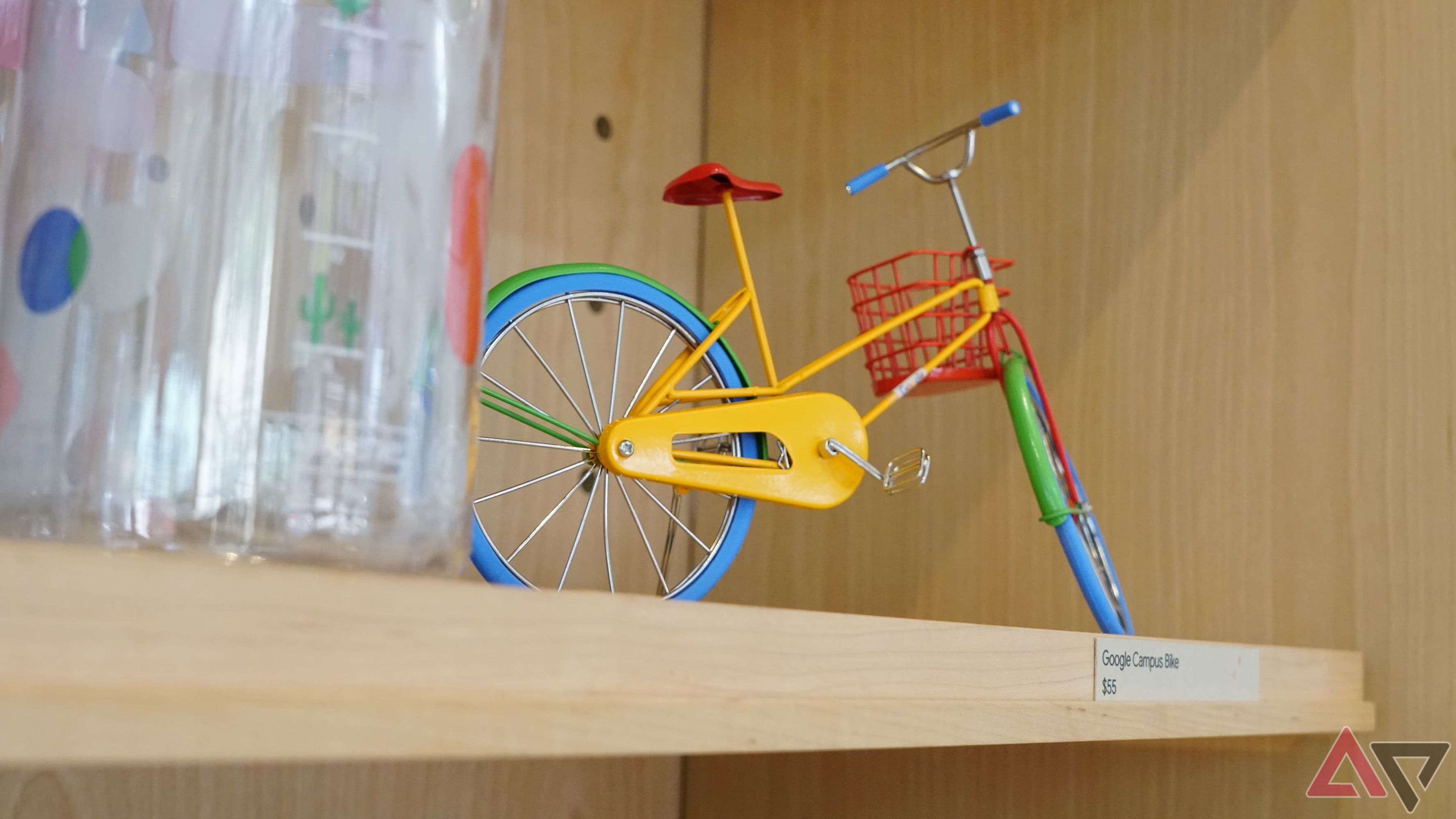 A scale model bicycle painted in Google's brand colors of blue, green, red, and yellow.