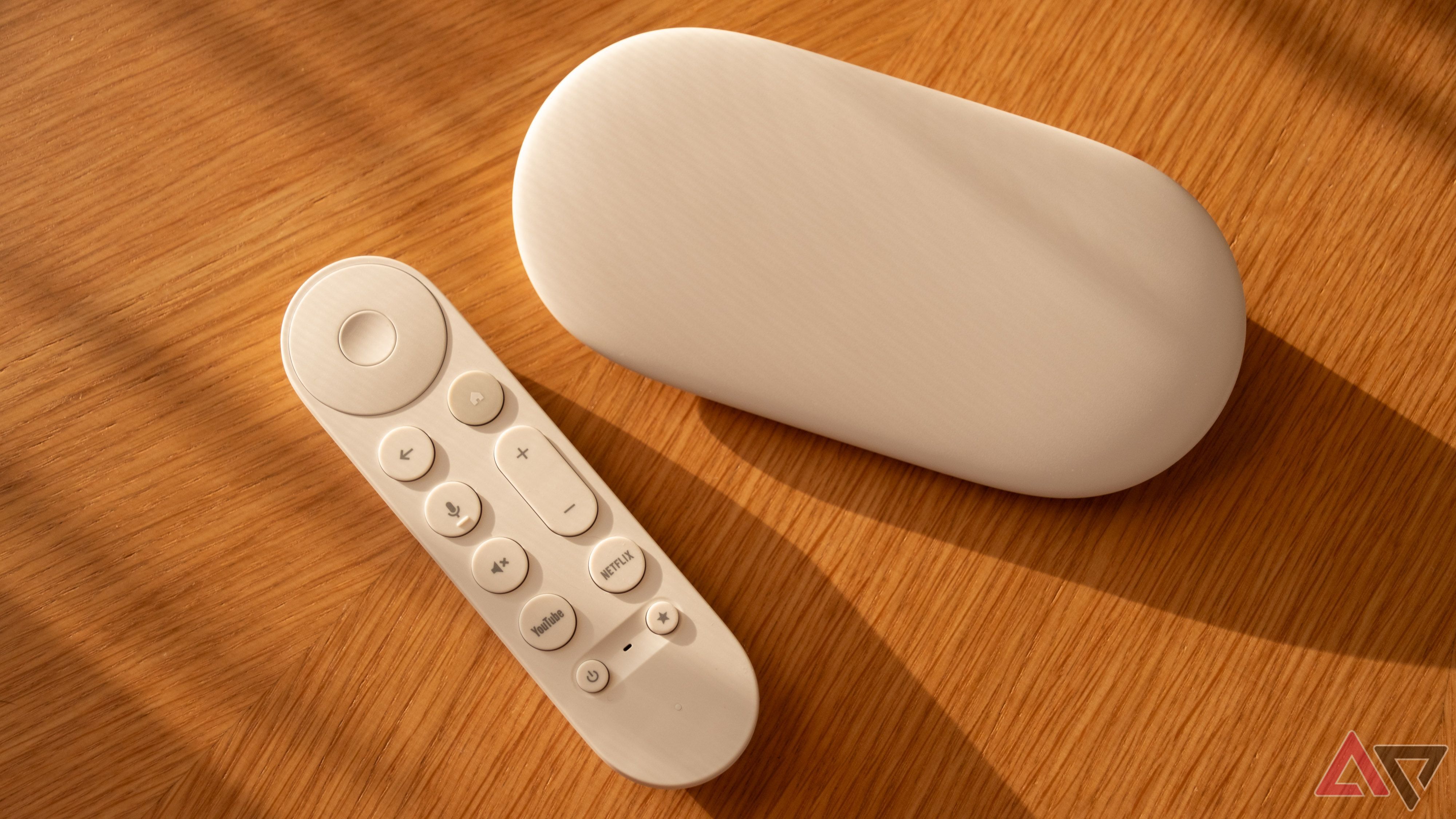 Google TV Streamer with remote on a wooden table