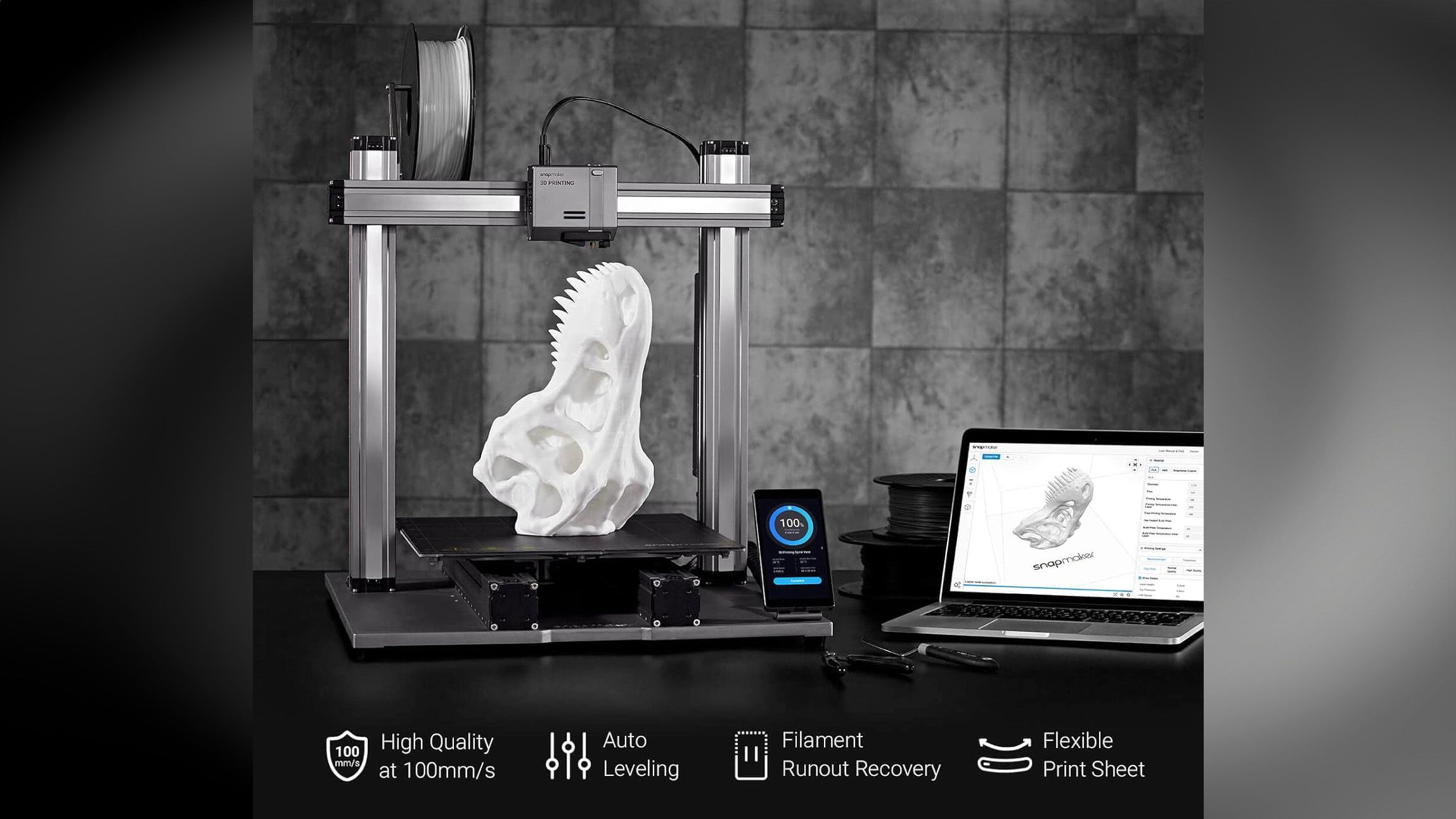 Snapmaker 3D printer next to laptop