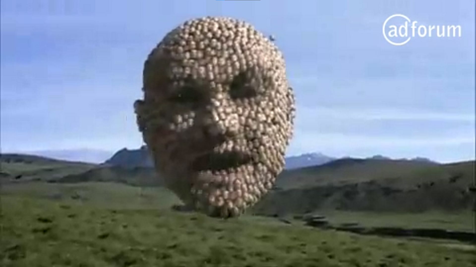 A 3D head made of smaller 3D heads, in an ad for the BBC Digital TV service
