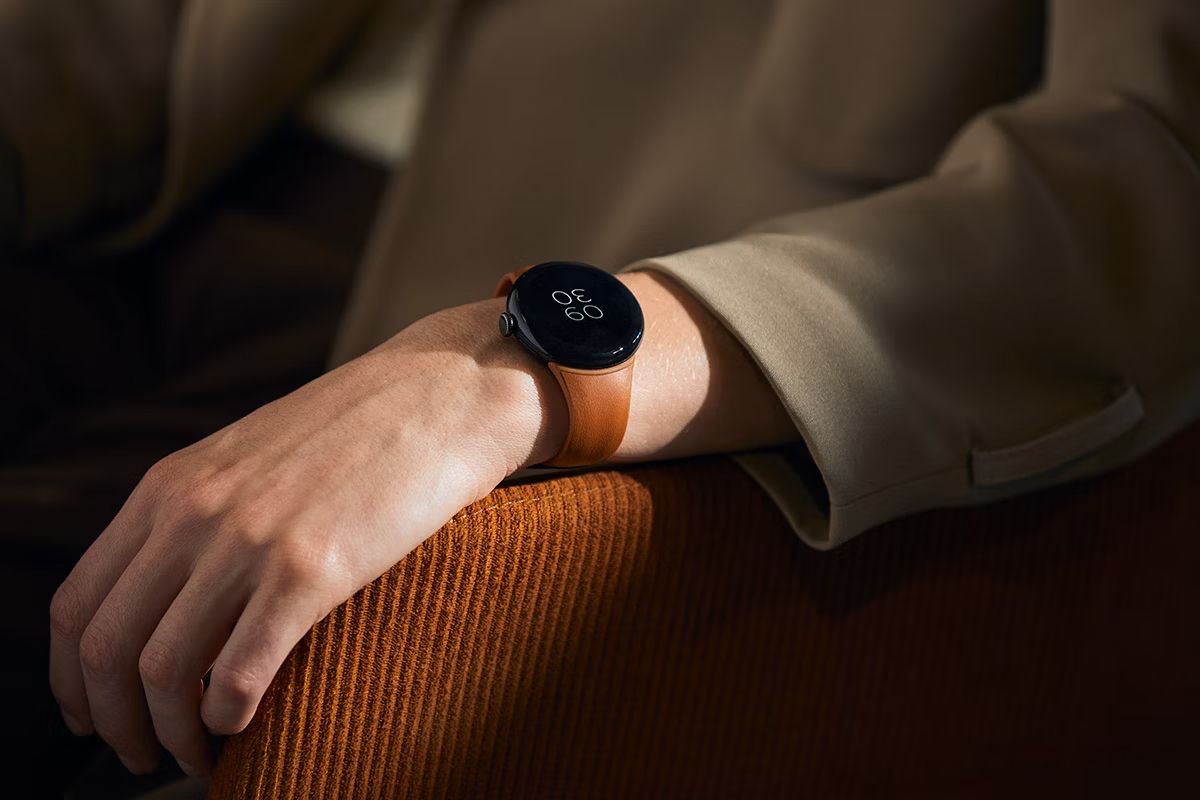 The Pixel Watch 3 worn on a wrist with the Bellroy leather band in terracotta