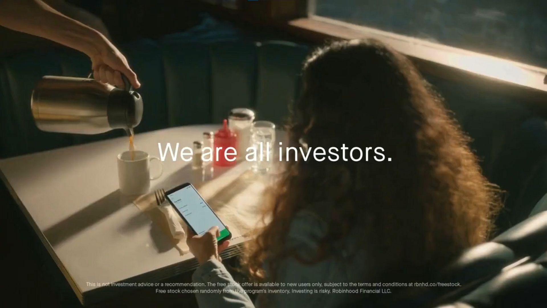 A screenshot of Robinhood's 2021 Super Bowl commercial reading, "We are all investors."
