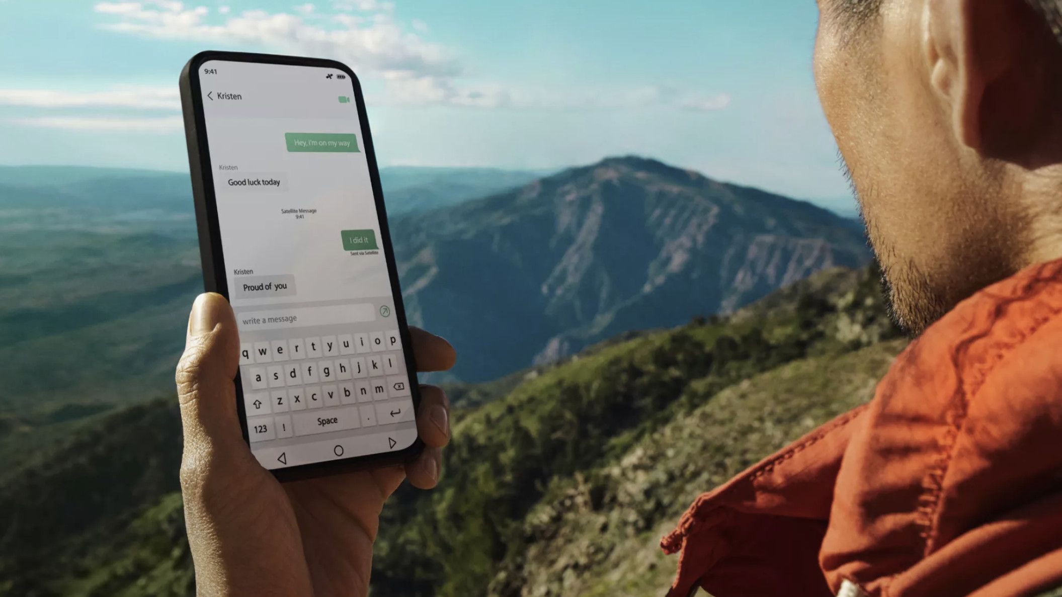 Man hiking with mobile phone in hand using satellite sms messaging