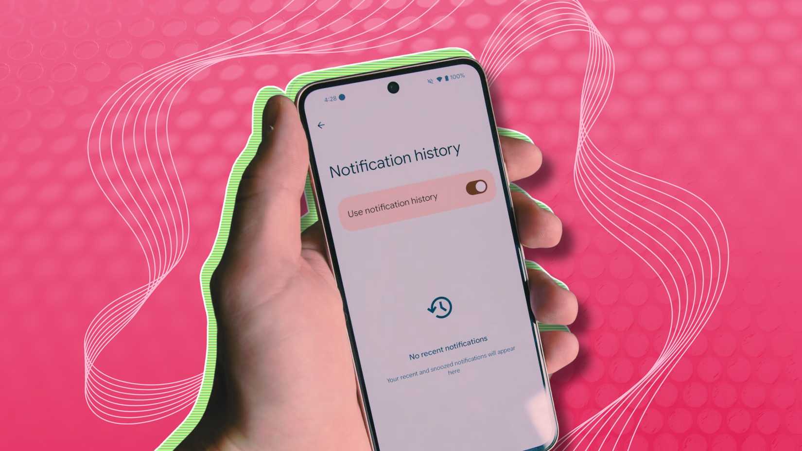 A person holding up a phone showing notification history on a pink background