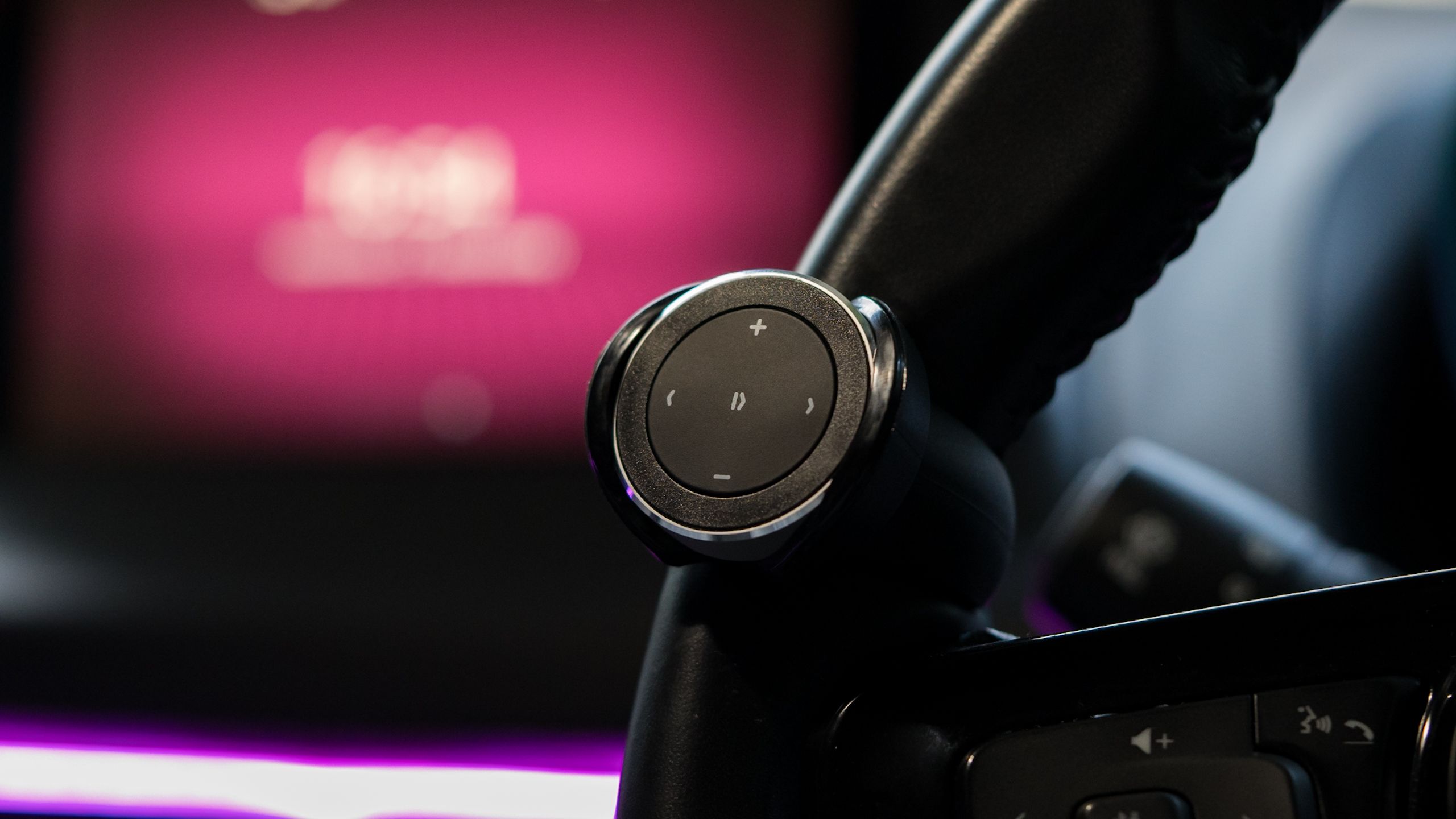 The Satechi Media Button attached to a steering wheel
