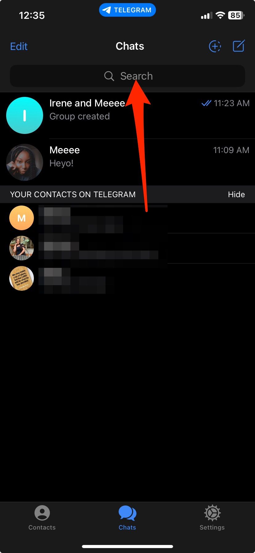 Arrow pointing at search bar in Telegram Chats menu on iPhone