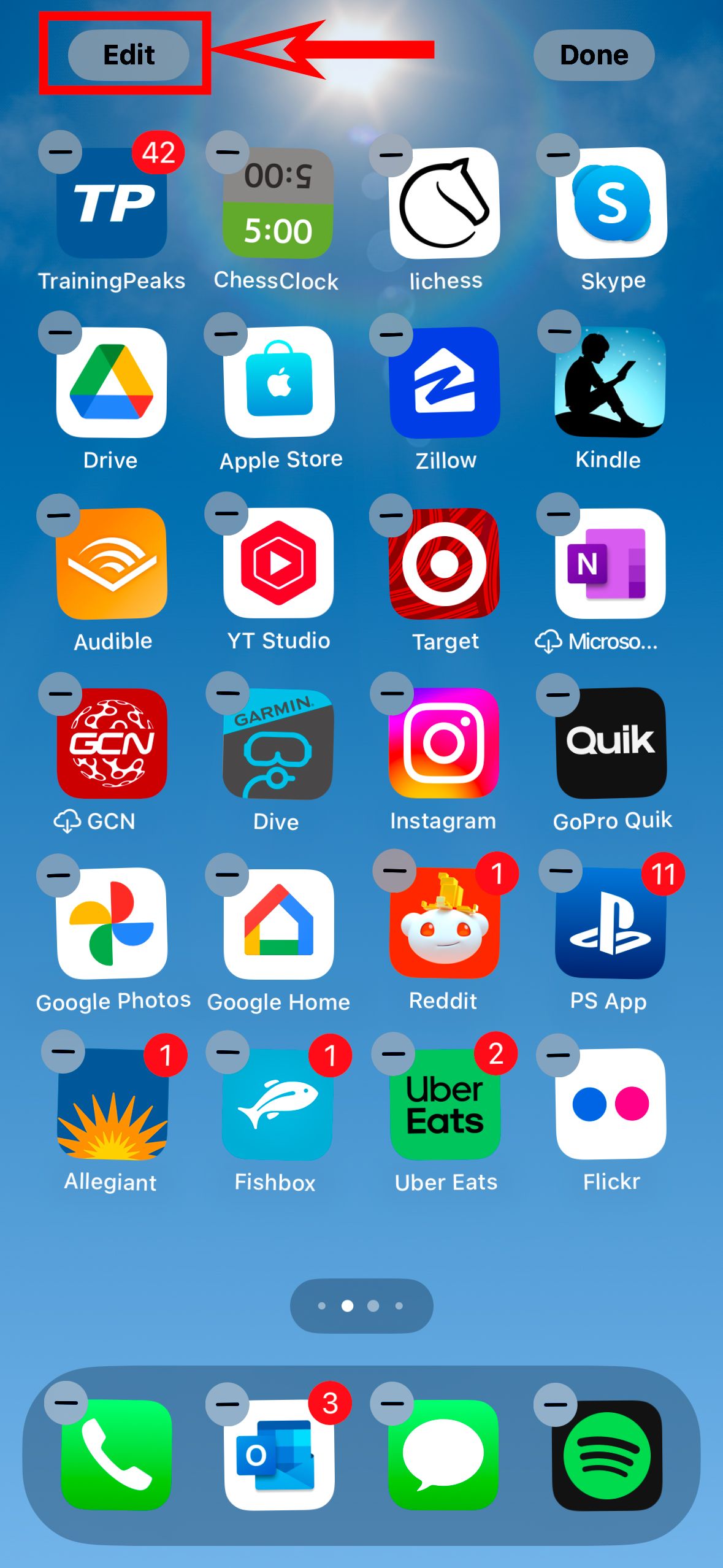 A screenshot of an iPhone home screen with the apps in jiggle mode and a red box around the Edit button.