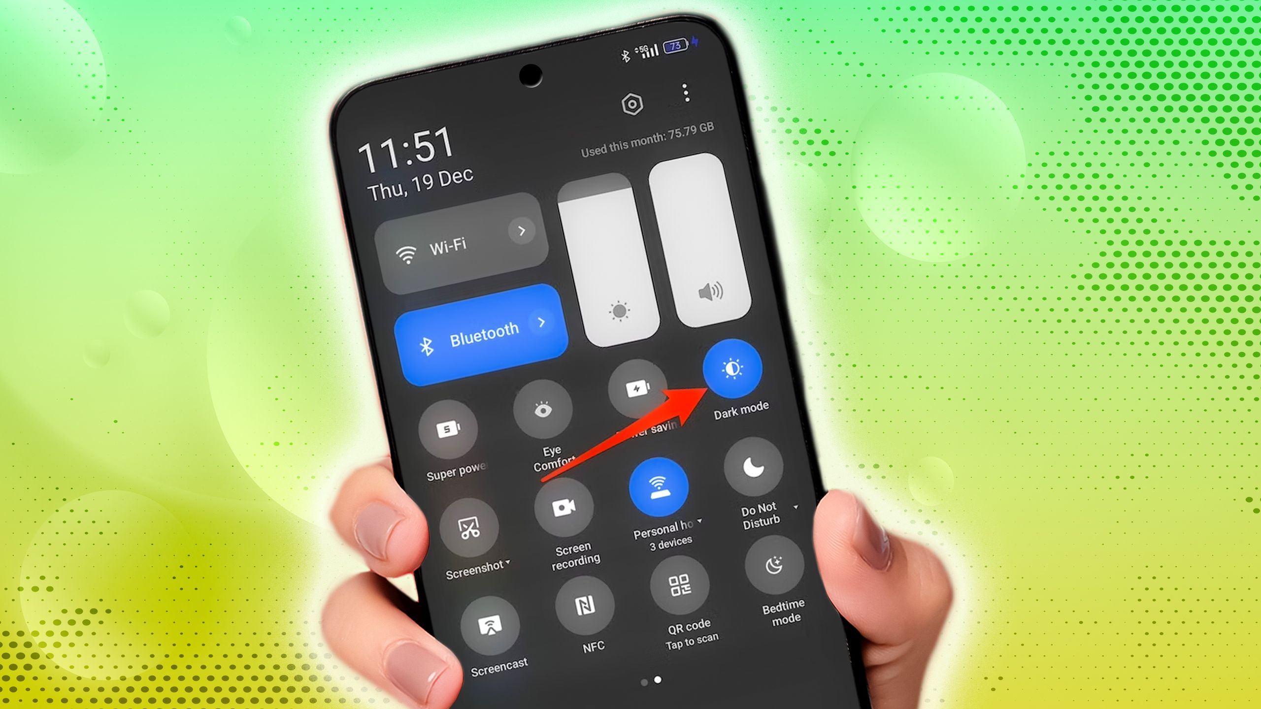 hand holding android phone showing quick settings menu