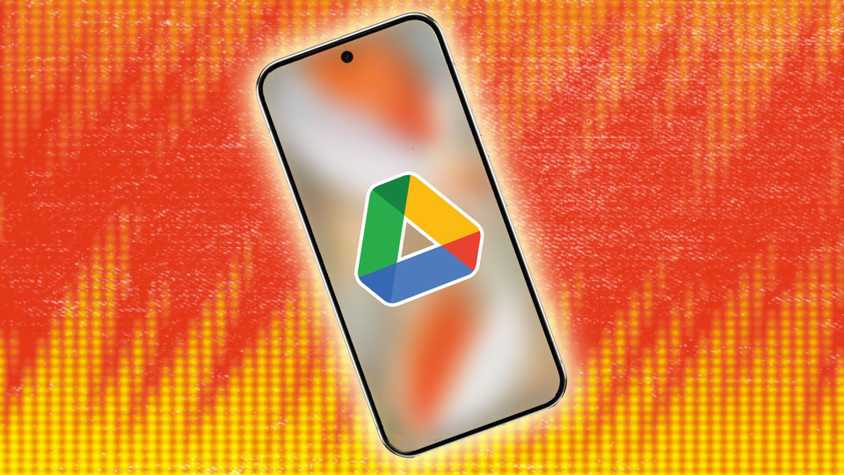 The Google Drive logo on a smartphone against a yellow and orange background