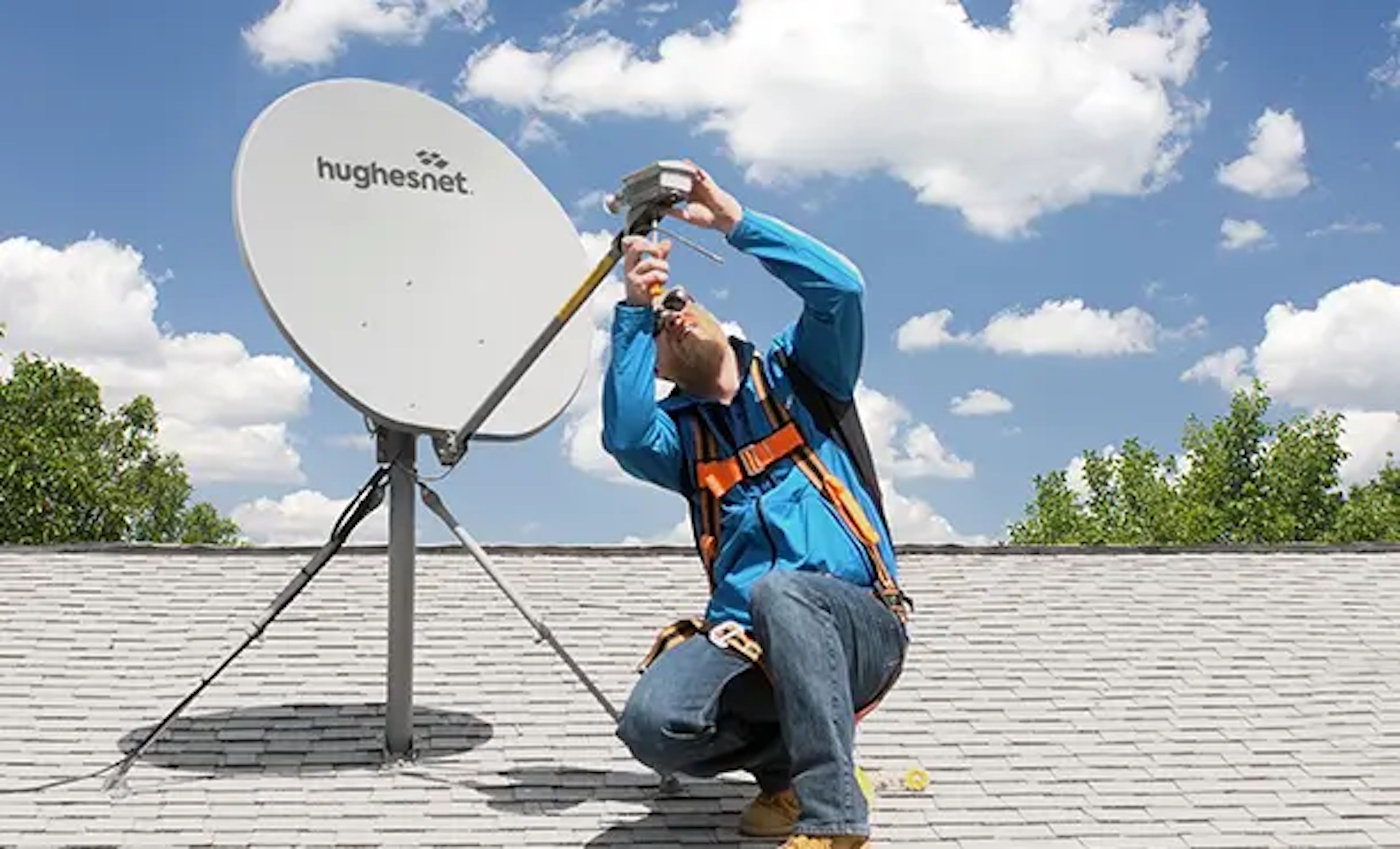 man fixing satellite on roof