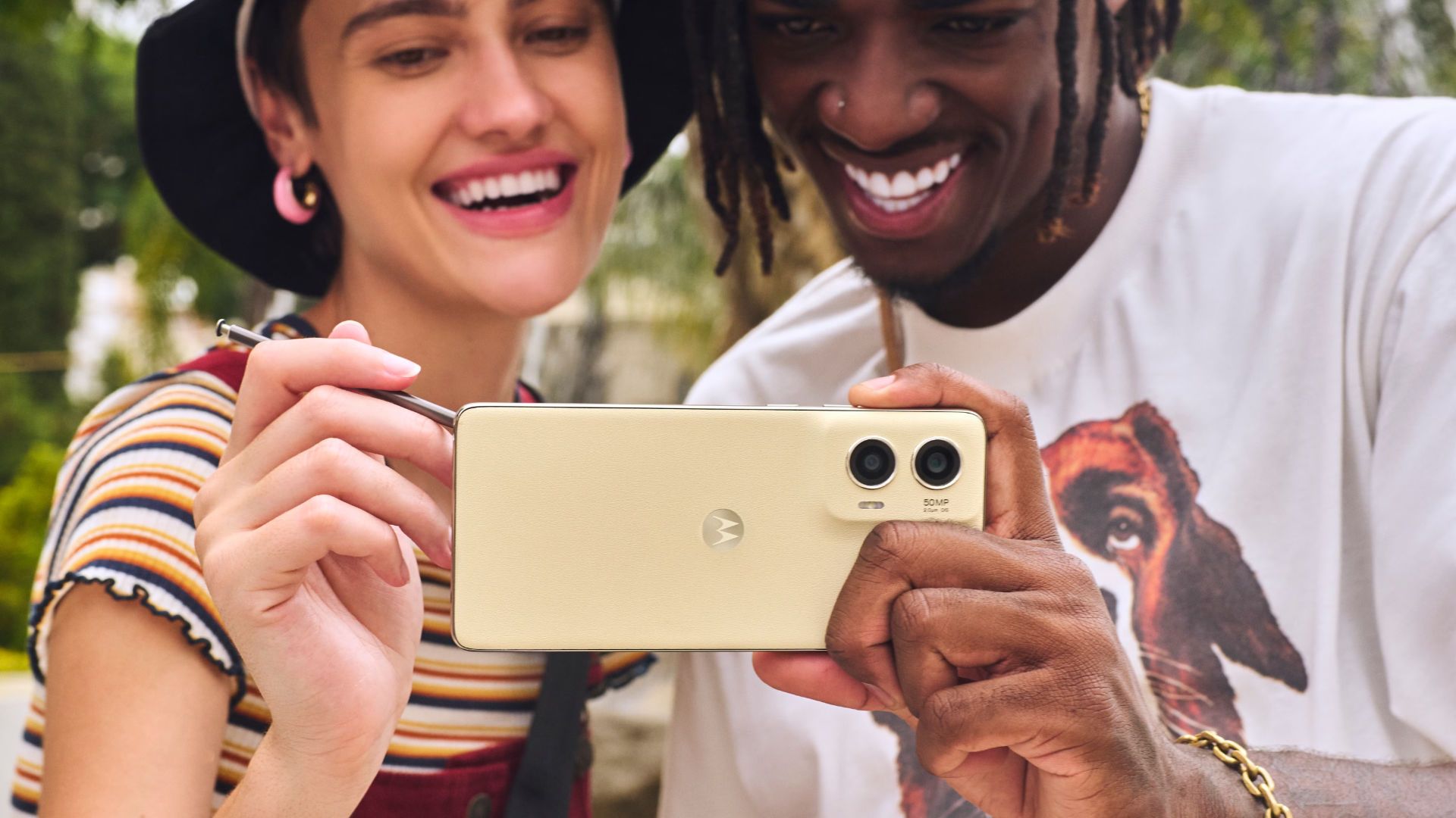 Two people take a selfie with the Motorola Moto G Stylus 5G.