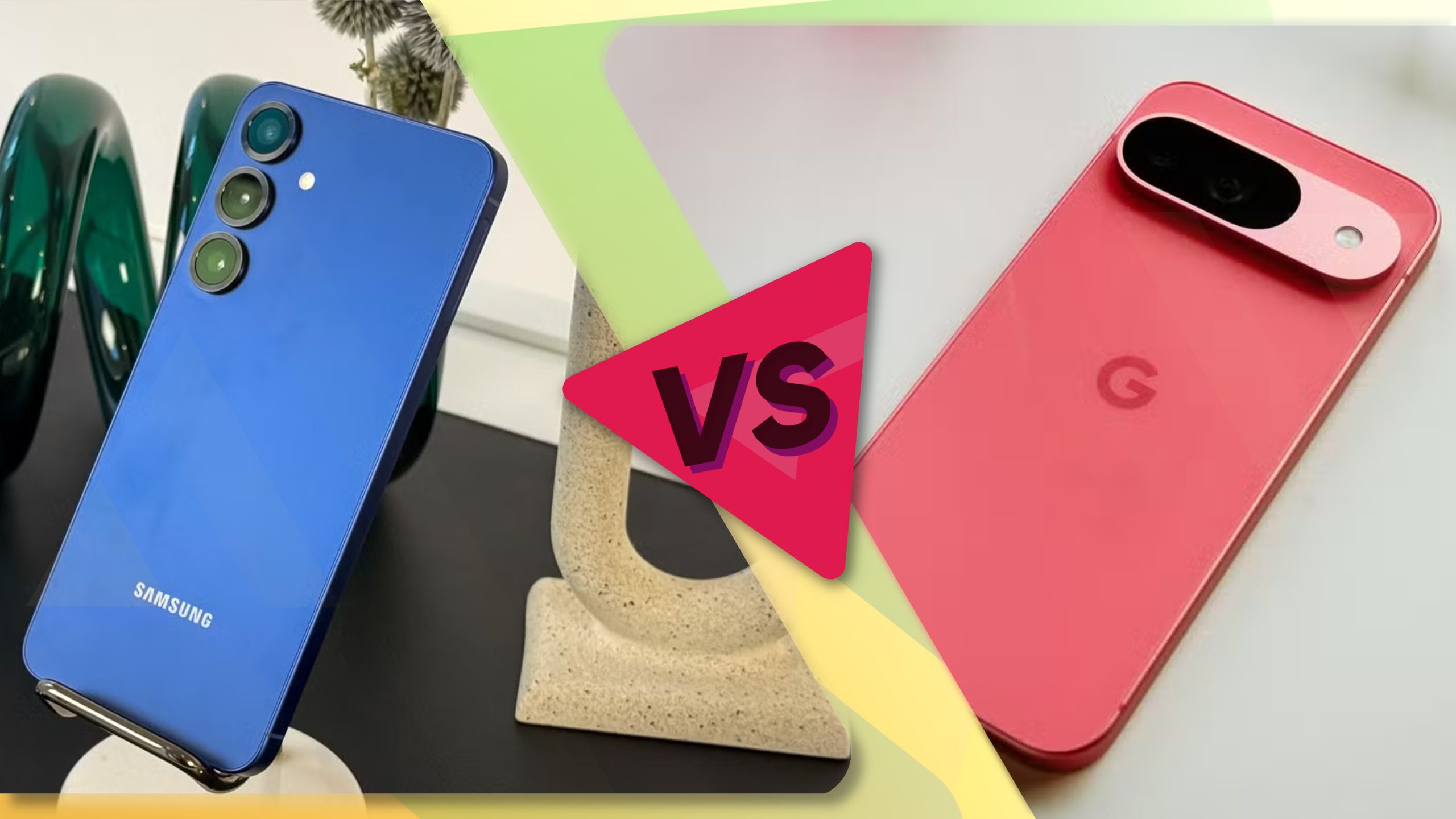 A blue-ish smartphone on the left on a stand, and a coral smartphone face down on a desk on the right