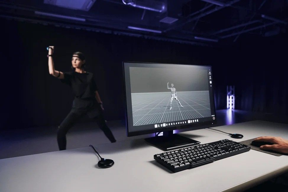 A studio for motion capture showing the Sony XYN headset and capture software in use