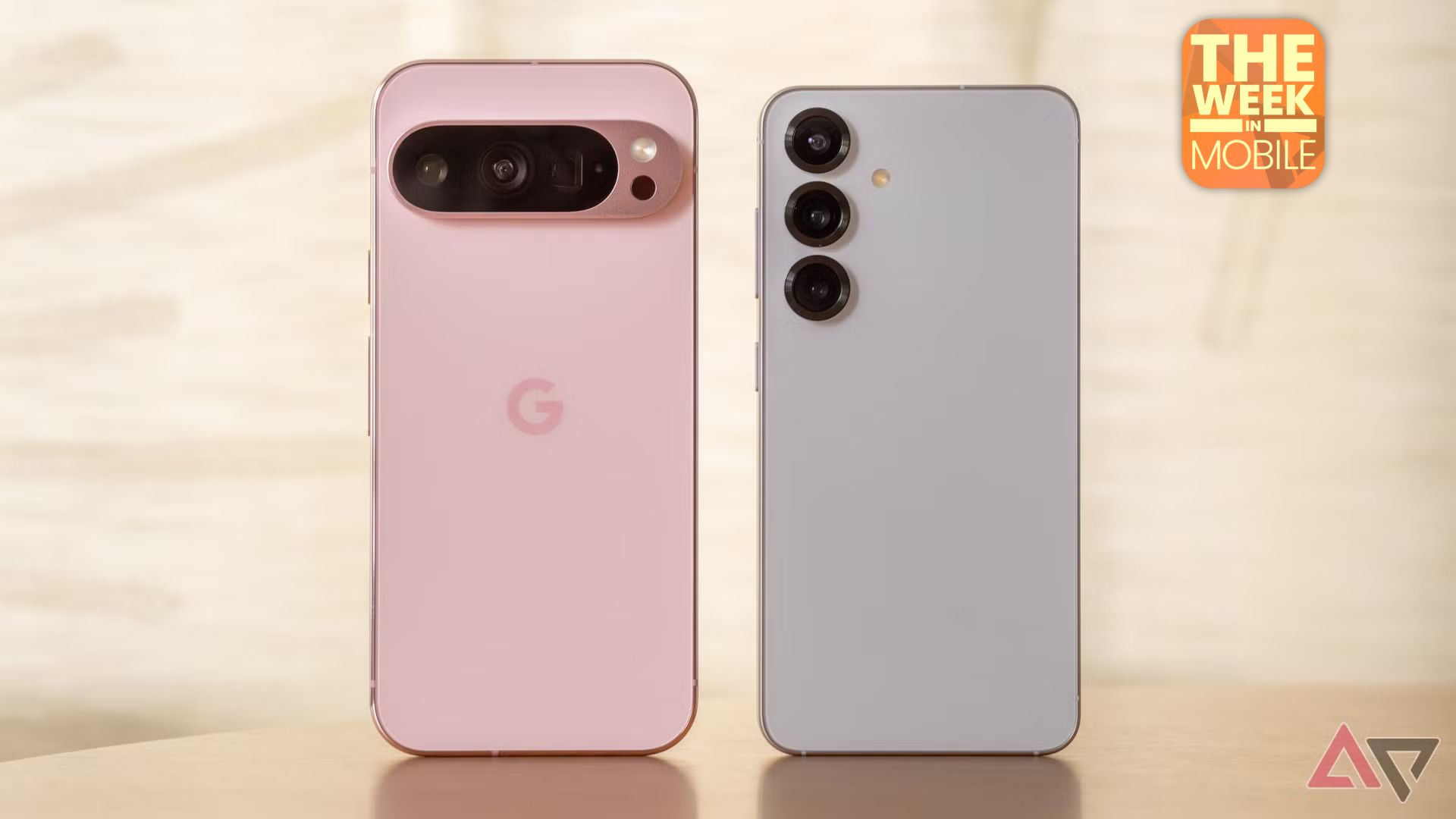 Pink Pixel 9 Pro, standing next to the blue Samsung Galaxy S25