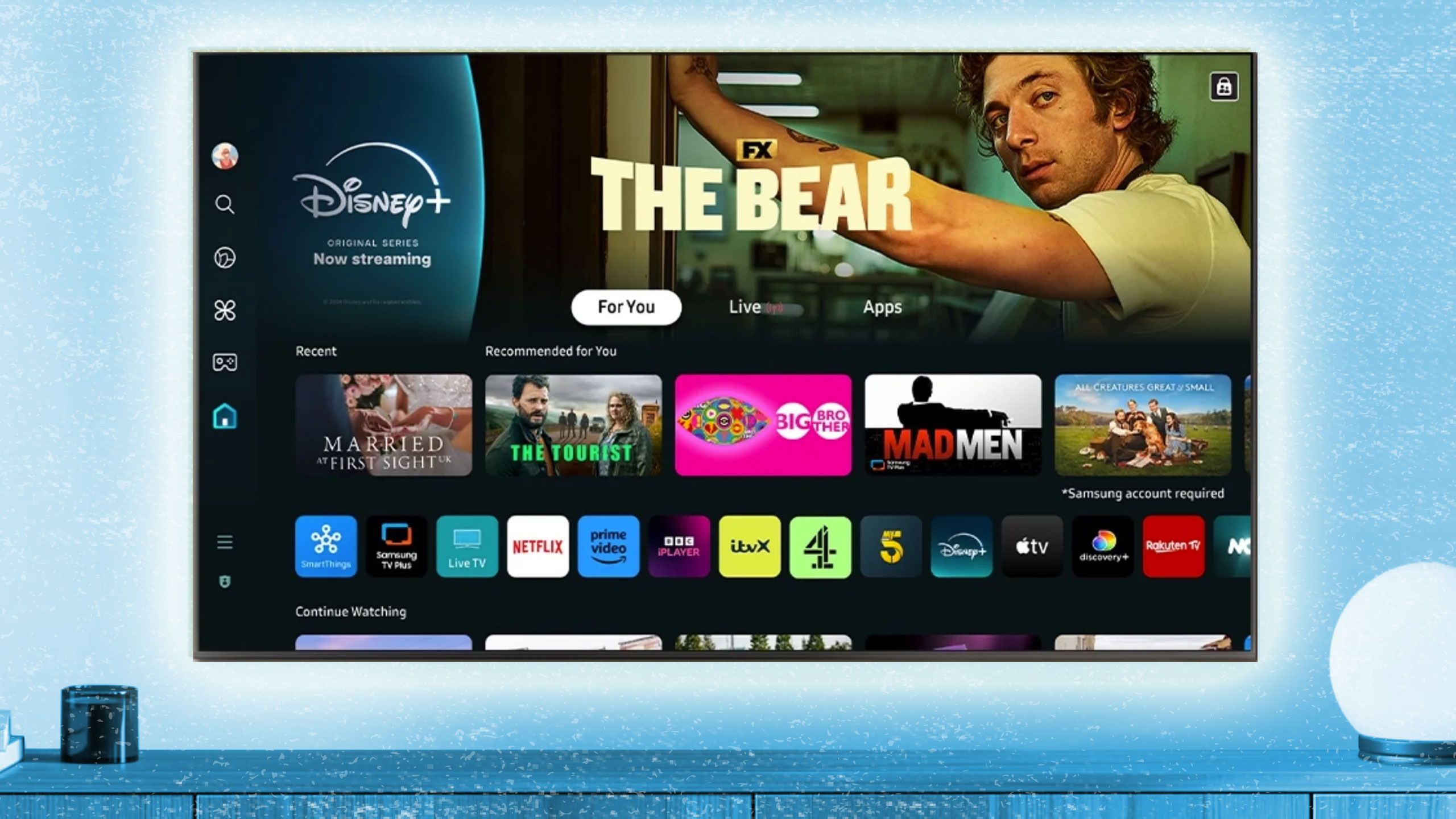 Apps displayed on a wall-mounted Samsung smart TV