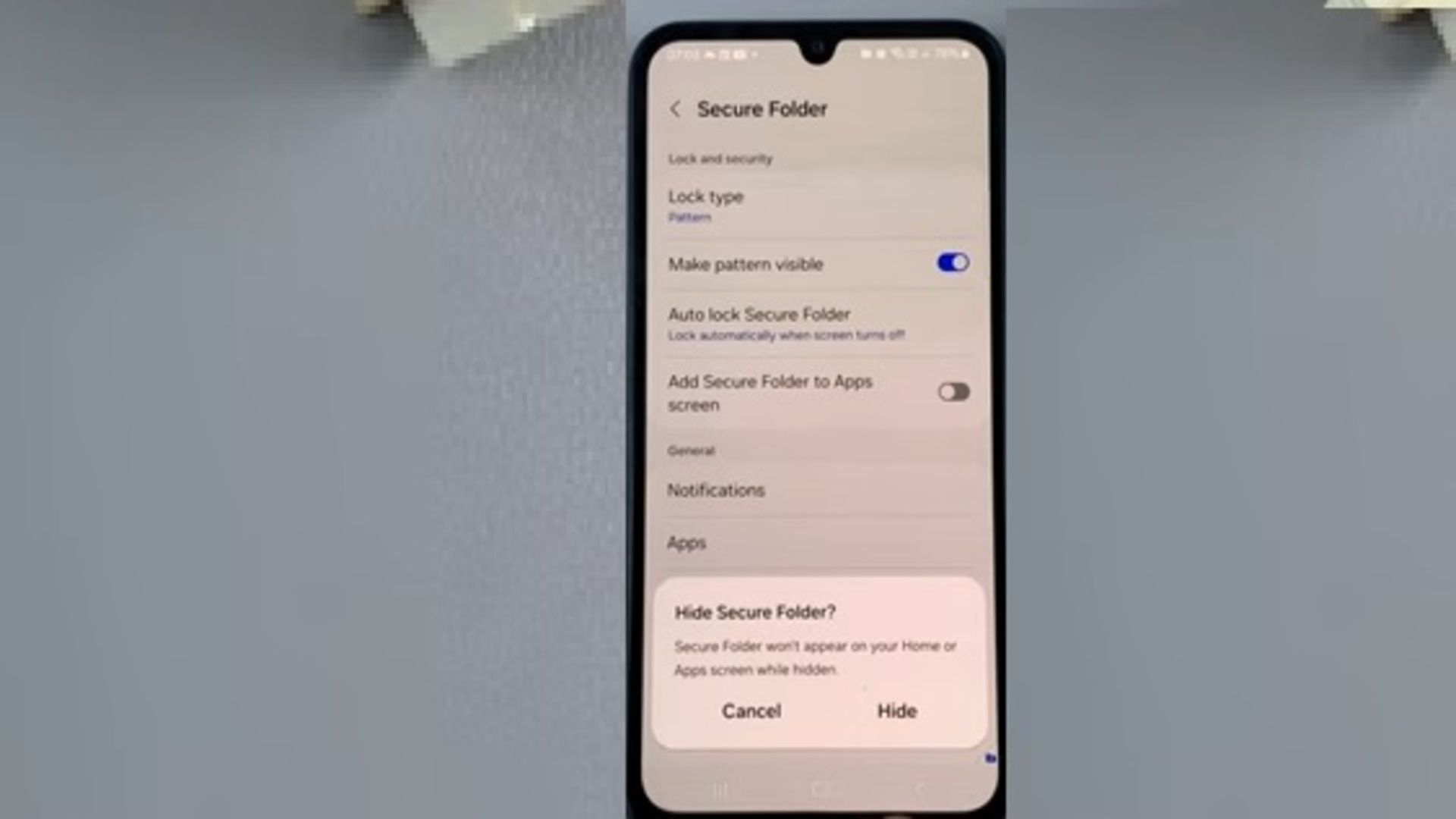A screenshot showing a Hiding Secure Folder on Samsung prompt