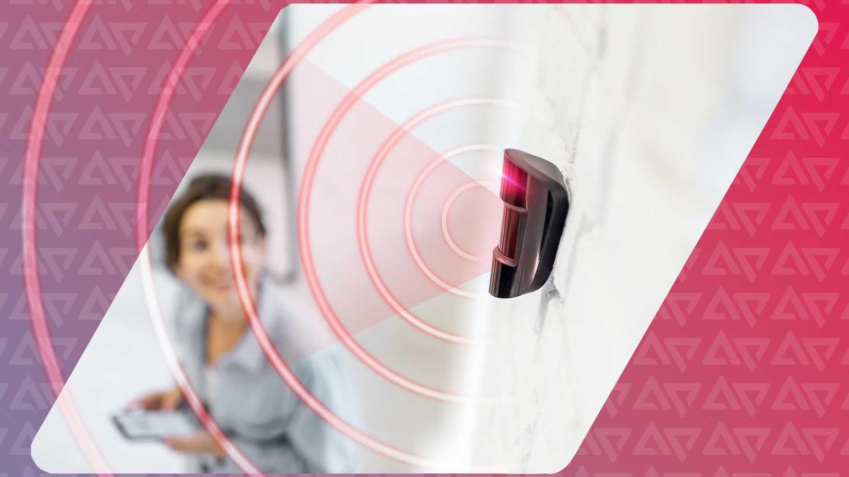 A motion sensor with a woman in the background controlling it.