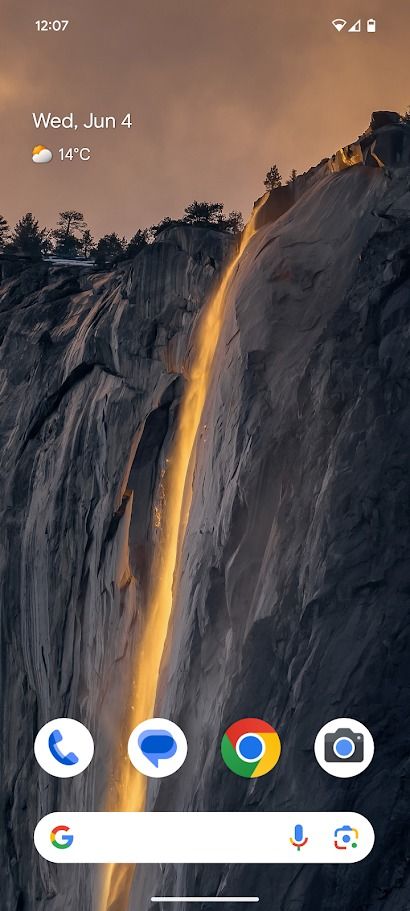 blank android home screen showing wallpaper of a cliff