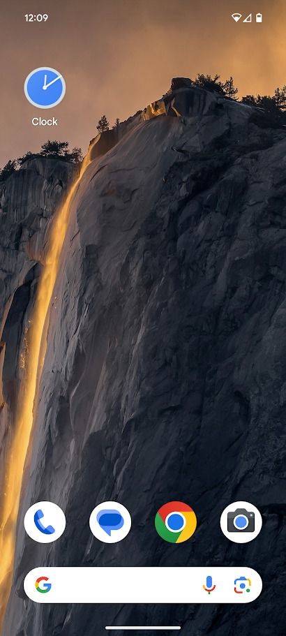 blank android home screen showing wallpaper of a cliff