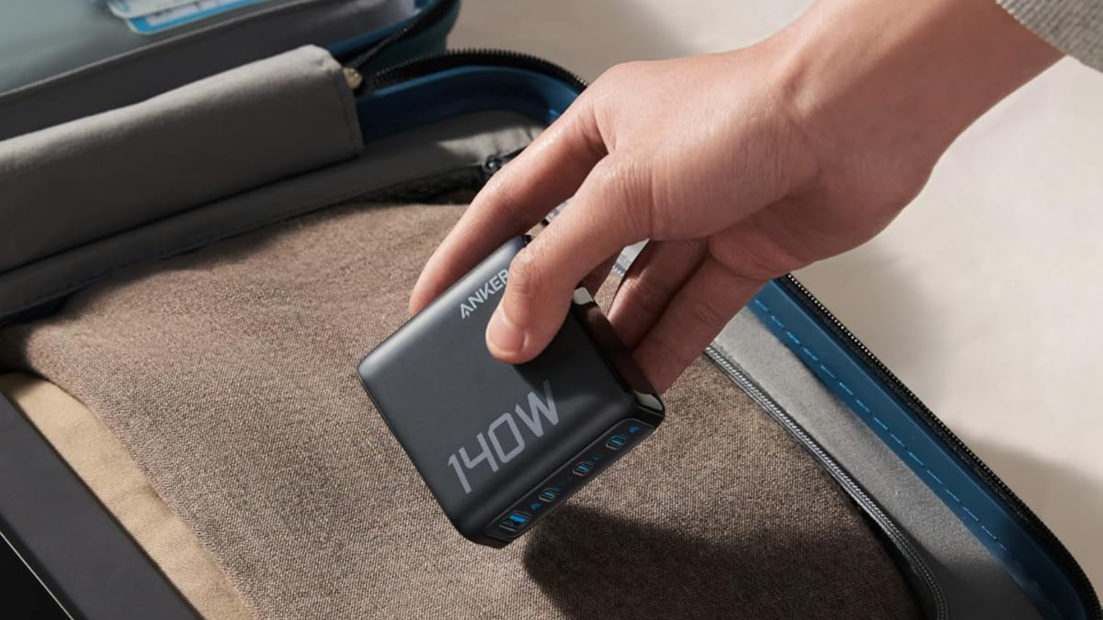 Person holding Anker 140W charger