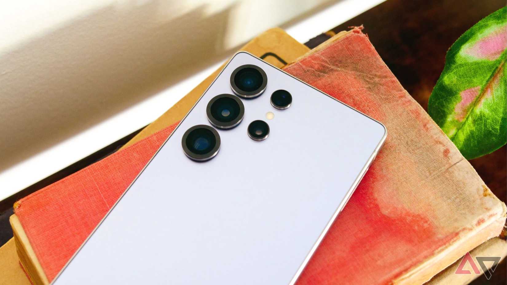 Samsung Galaxy S25 Ultra face down on top of books