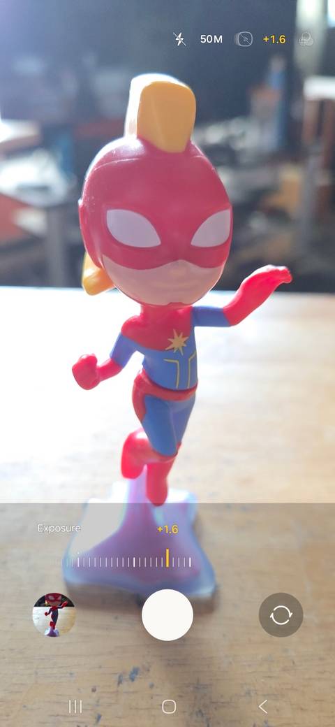 Using the brightness slider to increase exposure while taking a photo on a samsung phone