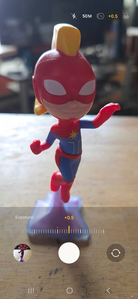 Decreasing the brightness to reduce exposure while taking a photo on a Samsung phone