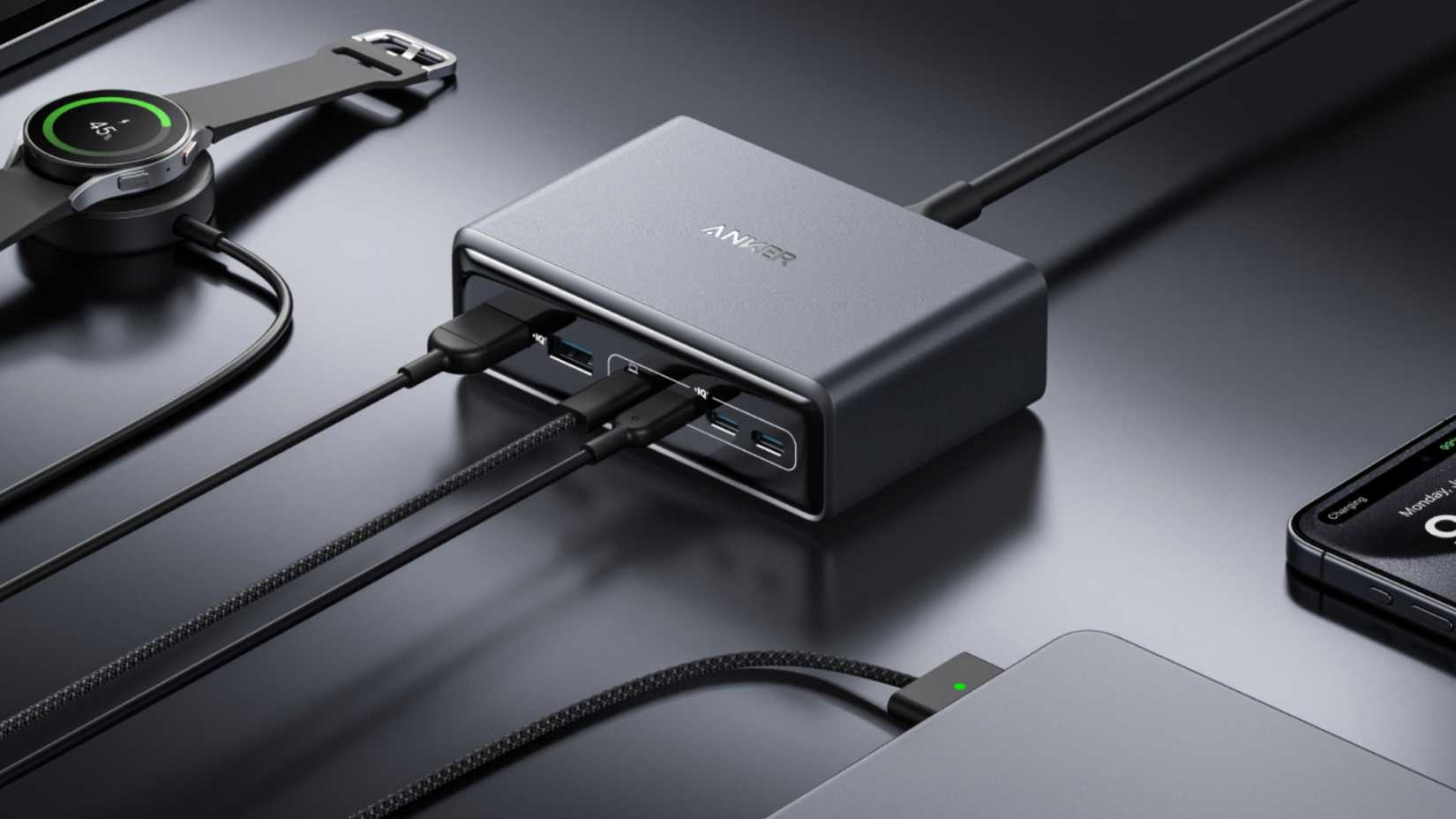 The Anker Prime GaN 200W charging station connected to devices on a desk.