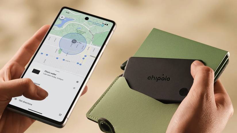 The Chipolo Card in a wallet as a smartphone user tests it.