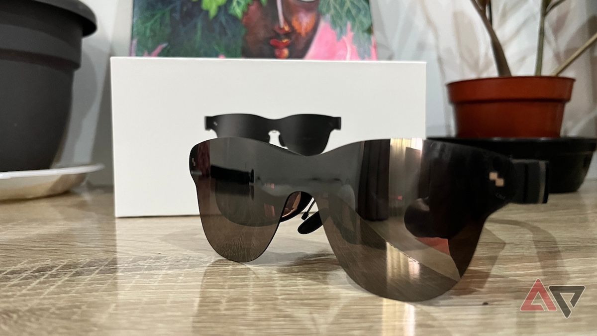 Black smart glasses placed in front of table decor
