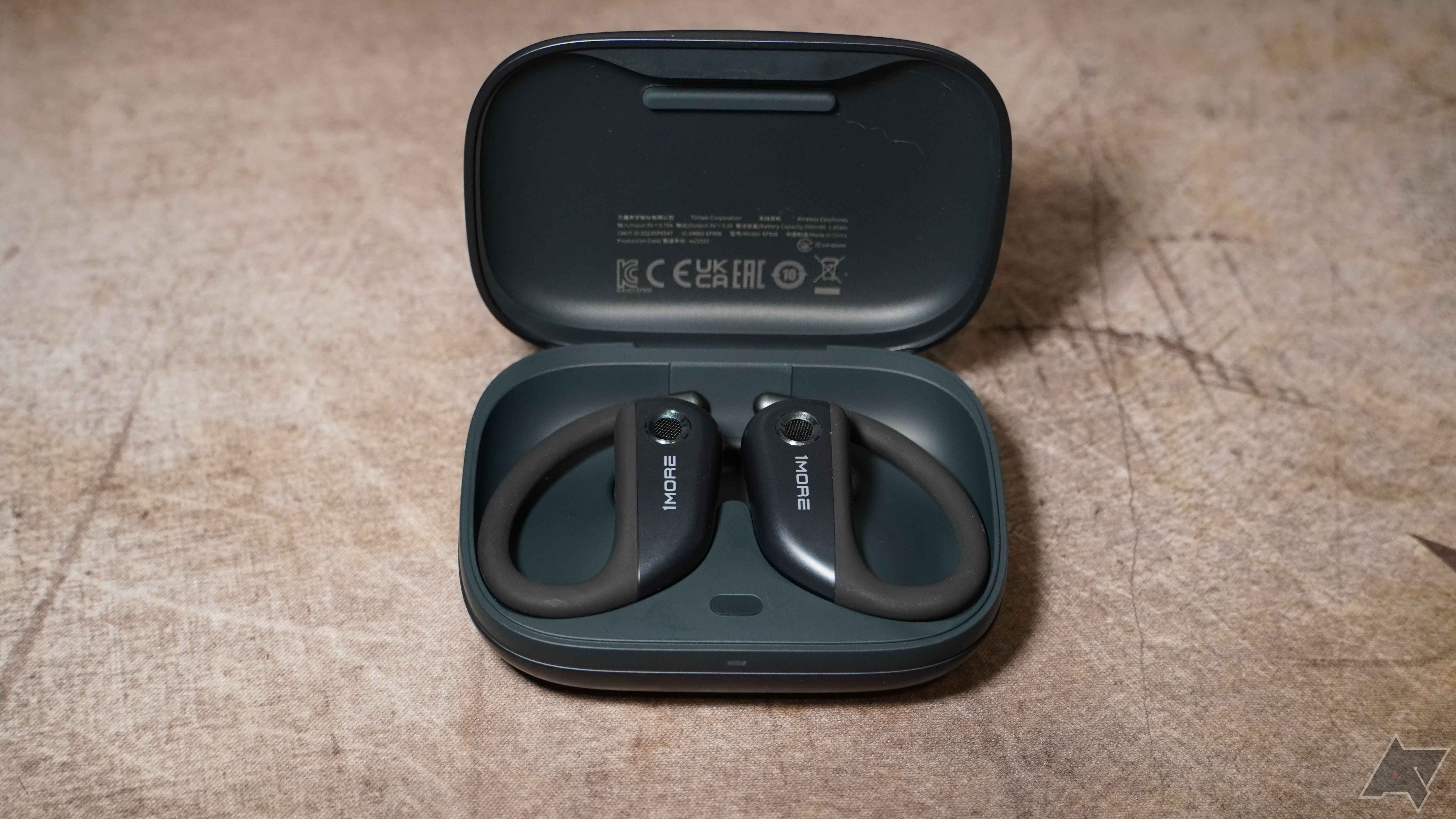 1More Fit Open Earbuds S50 in their charging case