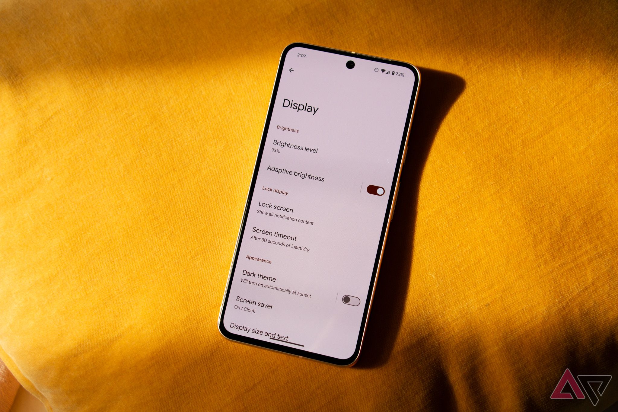 Google Pixel 8 with its screen showing the Display settings menu options